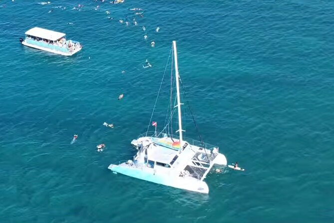 Board from Waikiki Beach for Aloha Hour Sail on Hāwea Catamaran - Drinks, music, and the happy-hour mood