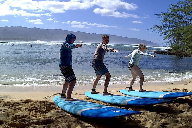 Group Surf Lessons for beginners on the North Shore of Oahu - Entering small waves on the North Shore