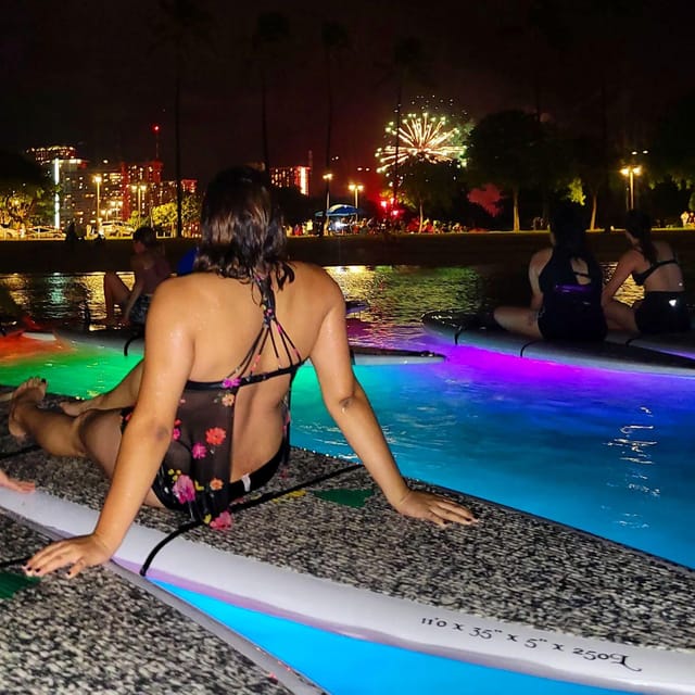 Honolulu: Fireworks Glow and Flow Yoga Class - The LED-lit SUP board changes the practice
