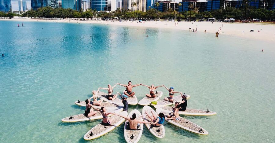 Honolulu: SUP (Standup Paddleboard) Yoga Class - Wading out and anchoring the boards