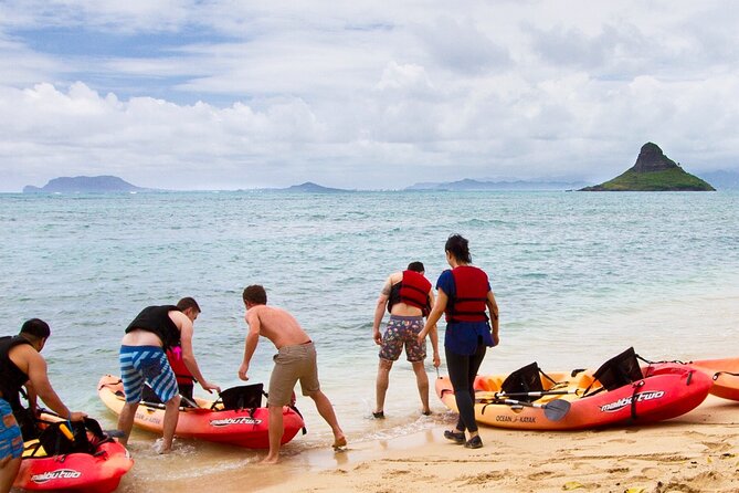 Mokolii Island Self Guided Kayak Tour - Picking up and carrying the kayak