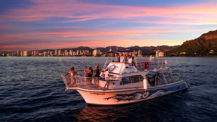 Oahu: Premium Waikiki Sunset Party Cruise with Live DJ - Waikiki lights from the open water