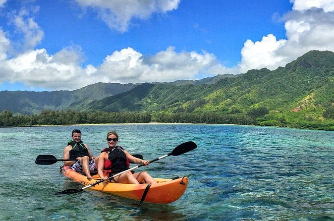 Rainforest River Kayak Self-Guided Kayak Tour - Passing the homes and opening toward the mountains