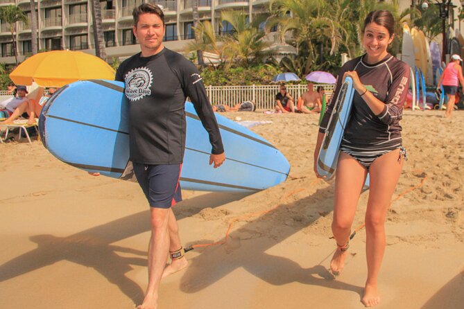 Semi-Private Surf Lesson for 2 or 3 people on Waikiki Beach - Learning to paddle and catch your first wave