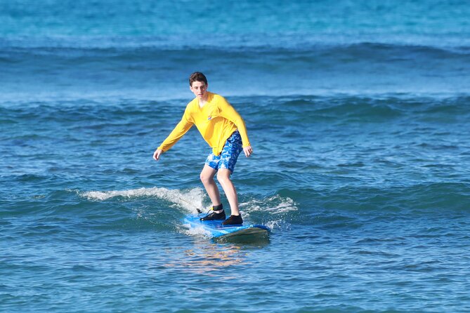 Semi-Private Surfing Lesson in Waikiki, Oahu - Taking the board into the water