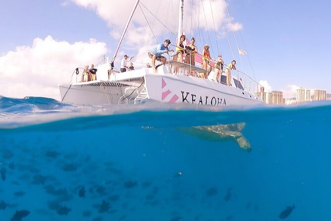 Sunset Boat Cruise: Swim and Cruise Waikiki - Crew, music, photos, and the onboard mood