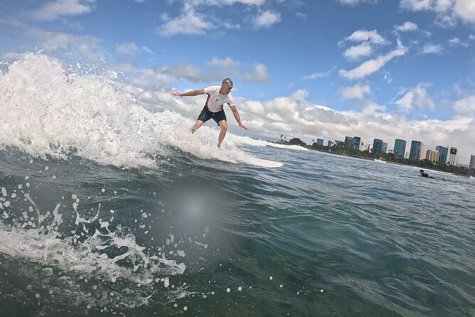 Surf Lessons get your Social Media video & photos you Surfing HI. - Catching waves every five minutes or less